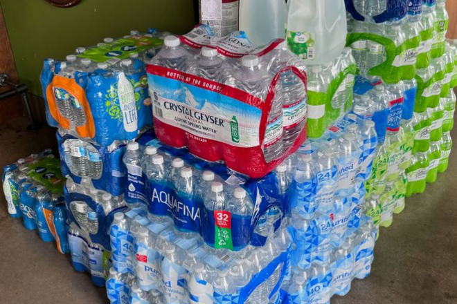 cases of stacked water bottles at Hank's Downtown Dive in Cary