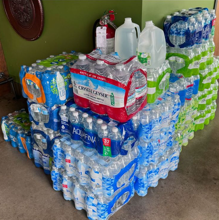 cases of stacked water bottles at Hank's Downtown Dive in Cary